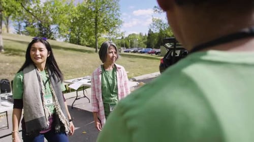 Volunteers Meeting in Sunny Parking Lot