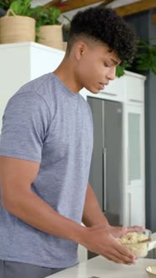 Man placing carrots and cucumber on board slicing with knife cooking, labels animating near hands