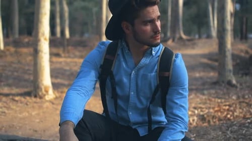 Guy vaping in the woods