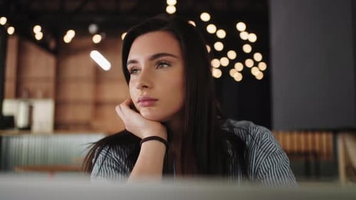 Tired Freelancer Or Student Woman Looking At Display Of Laptop When Working Remotely In Cafe