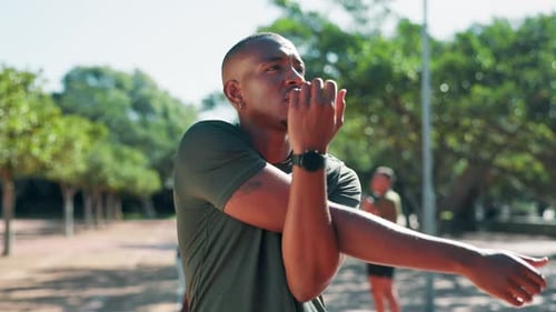 Man, fitness and stretching with arm at park for workout preparation, exercise or outdoor training