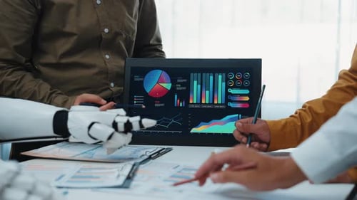 Business Meeting with Robot Arm Analyzing Data