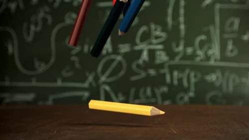 Pencils Fall on the School Desk Filmed on a Highspeed Camera at 1000 Fps