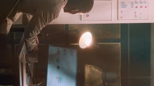 Vertical Video Employee Enjoys Coffee During Nightshift