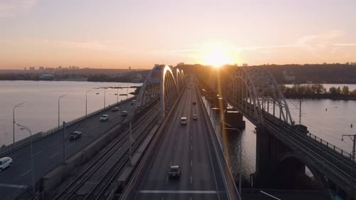 Beautiful Urban Landscape with Cars Moving on Bridge Over the River