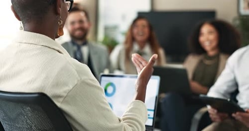 Team Celebrates Success in Modern Office Meeting