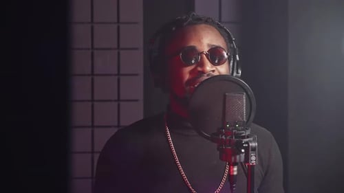 Black Male Singer in Professional Music Studio