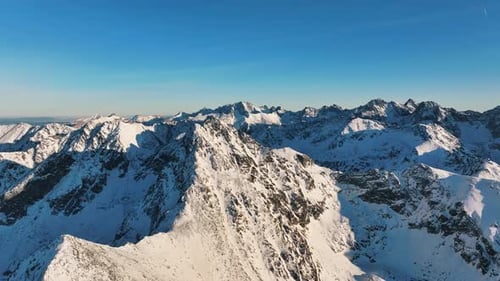 Explore the breathtaking aerial views of the snow-covered Alps mountains
