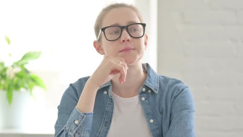 Woman Deep In Thought Indoors During Daytime