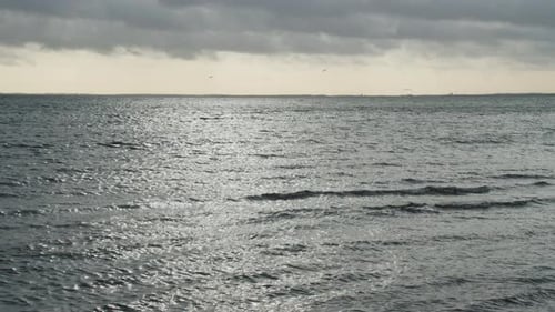 Idyllic Colorful Seascape Wavy Water Surface Reflects the Sun's Rays After a Storm