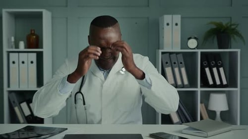 Stressed Doctor at Office Desk