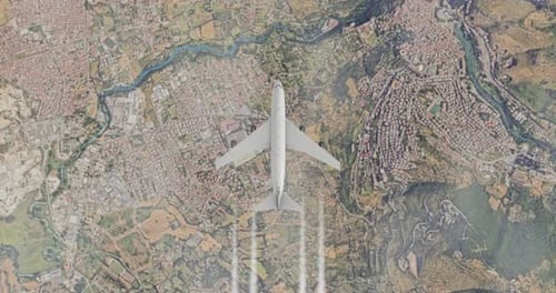 Aerial View of Airplane Flying Over City and Landscape
