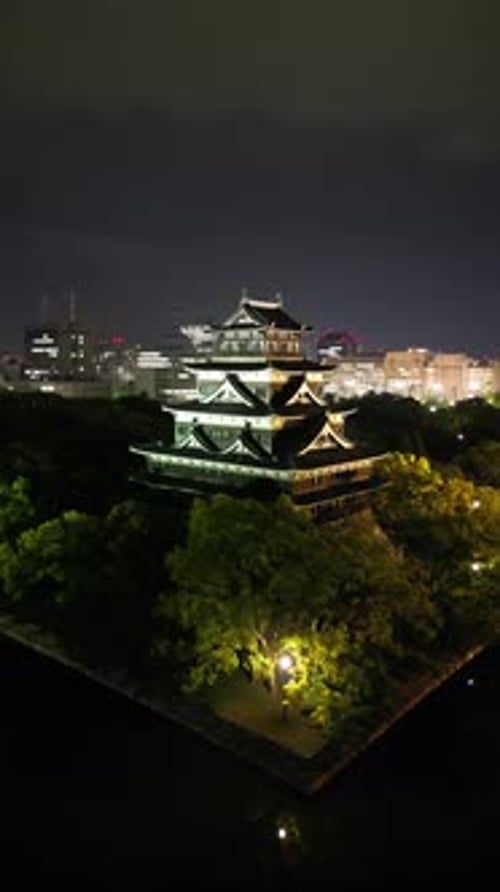 Aerial video of the Hiroshima skyline with Hiroshima Castle in Japan