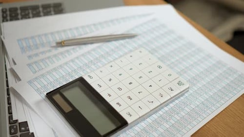 Modern Stylish White Calculator and Expensive Metal Pen on Important Financial Documents Displaying