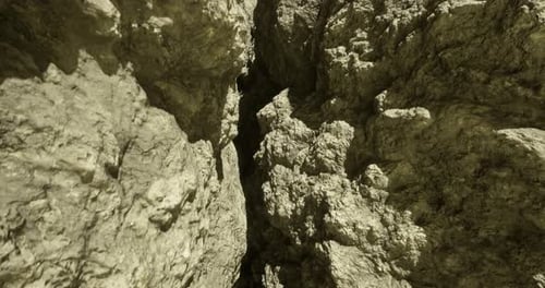Detailed View of Rocky Terrain in a Narrow Canyon During Daylight Hours