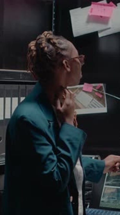 Vertical Video Detective Partners Analyzing Criminal Records in Office