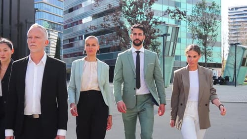 Diverse Business Team Walking to Work in City