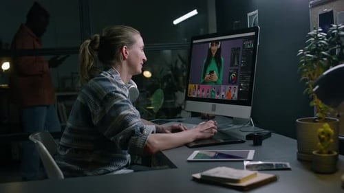 Female Designer Working on Commercial in Postproduction Studio
