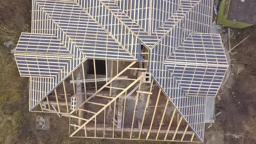 Aerial View of a House Under Construction Works Unfinished Brick Building with Wooden Frame for Roof