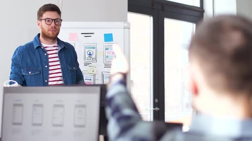 Business, Technology and People Concept - Man Showing User Interface Design On