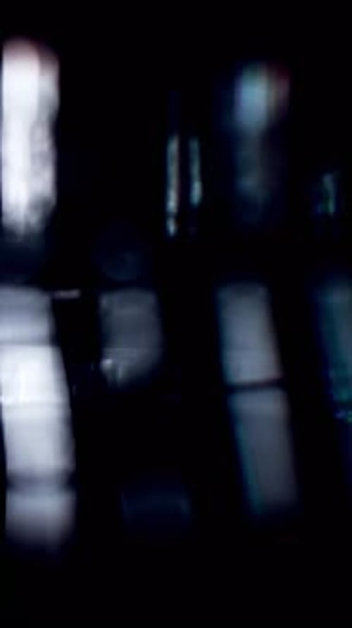 Glowing Light Patterns On Glass With Dark Background