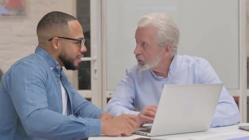 Business People Discussing Online Project in Office