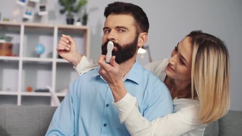 Excited Woman Reveals Positive Pregnancy Test to Partner