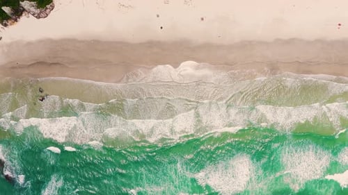 Peaceful view of beach with gentle waves and warm waves in the Mediterranean sea