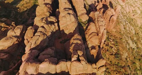 Group of rock formations with rounded tops from aerial erosion.