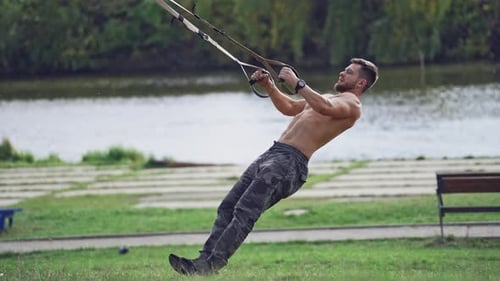 Fit young man exercising in park