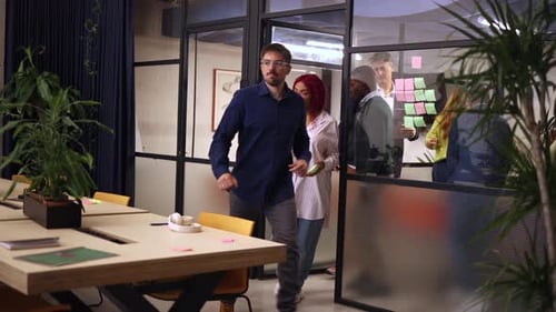 People Walk Through Modern Corporate Office