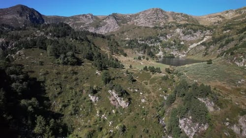 Aerial views of an alpine lake in the french Pyrenees at low altitude