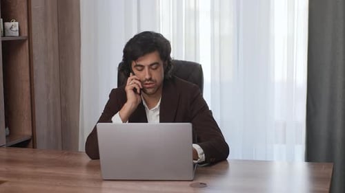 Portrait of Confident Focused Male Office Worker Calling Smartphone Discussing Project at Light