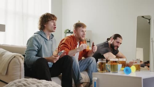 Friends Cheering Watching Sports at Home Celebration