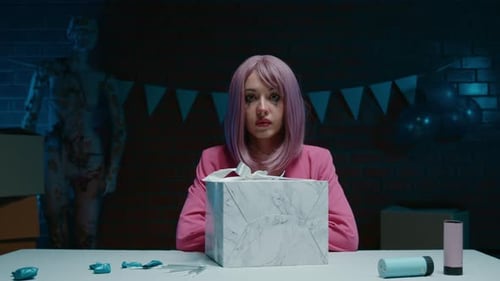 Sad Pink Hair Birthday Girl with Makeup Sitting with the Present