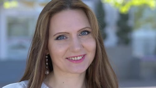 Woman Smiling Confidently In Close Up Portrait