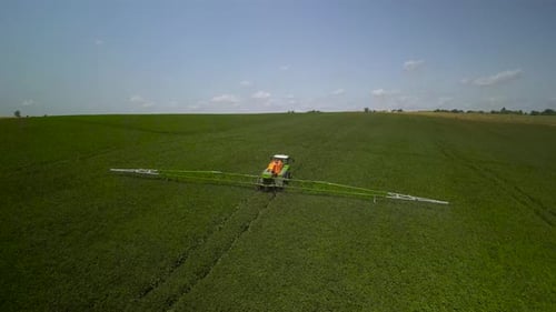 Spray Fertilize On Field With Chemicals In Agriculture Field