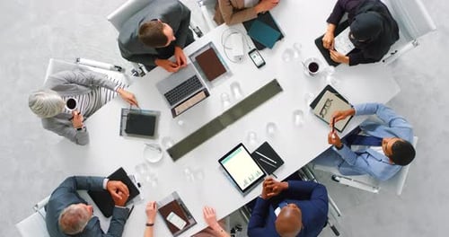 Diverse Professionals Team Meeting at Conference Table