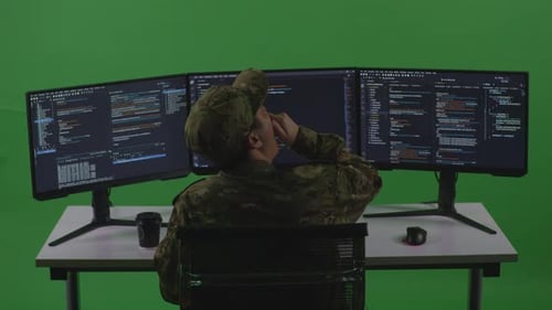 Man Soldier Developer Yawning Before Sleeping While Write Code With Multiple Screens In Green Screen
