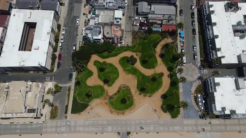 Aerial view of the Noble Park and the cityscape of Hermosa, LA, USA - tilt, drone shot