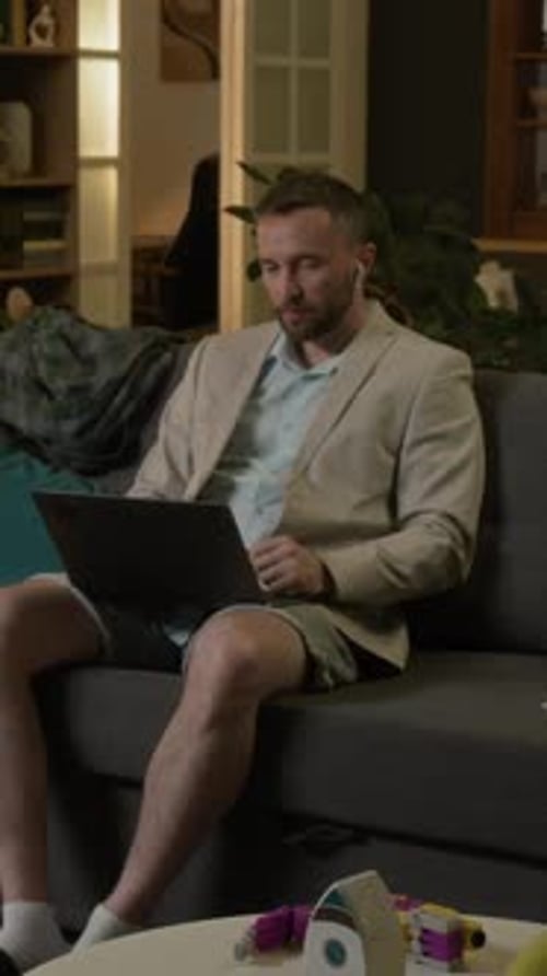 Man Talking on a Laptop Video Call at Home