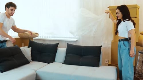 Young Couple Move Into New Apartment