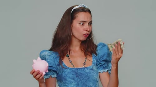 Young Adult Saving Money in Piggy Bank