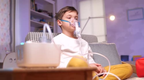 Child Receives Breathing Treatment at Home with Nebulizer