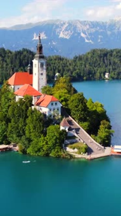 Lake Bled Island Church with Julian Alps in Background on Sunny Summer Day
