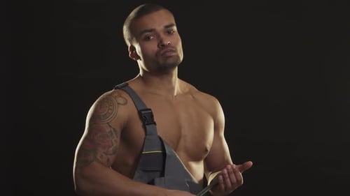 Muscular Man in Overalls