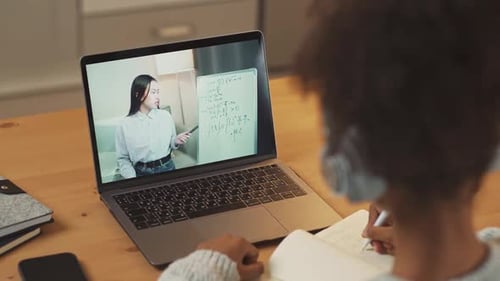 Child Attends Online Class at Home