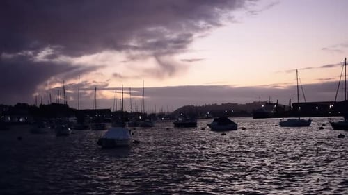 The sun setting over the boats