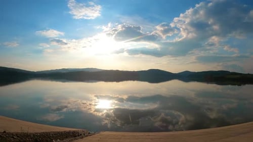 Cloudy sunset timelapse over the lake - cloudy sky timelapse - moving clouds