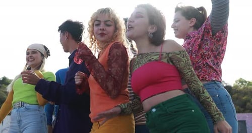 Young Adults Dancing Together in Urban Setting